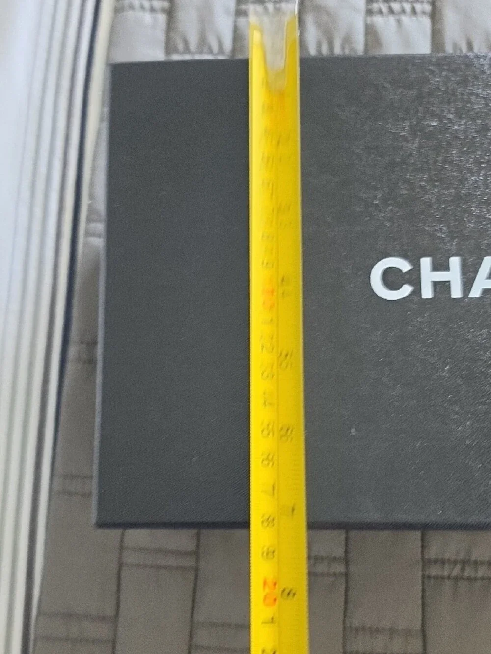 CHANEL Black Box with White Ribbon and Camellia Accent